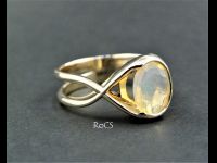 Opal set in by-pass gold band image